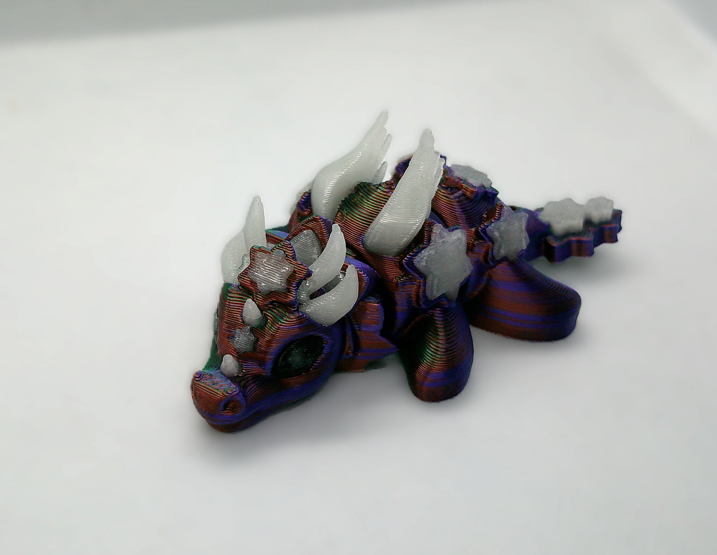 Purple and blue glowing mini dragon