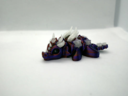 Purple and blue glowing mini dragon